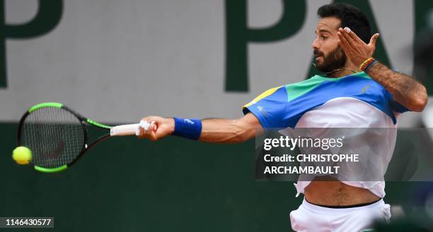 Italy's Salvatore Caruso plays a forehand return to Spain's Jaume Munar during their women's singles first round match on day two of The Roland...