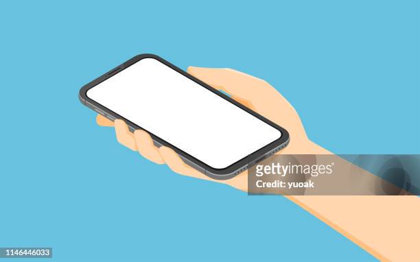 isometric hand holding smartphone - human hand stock illustrations
