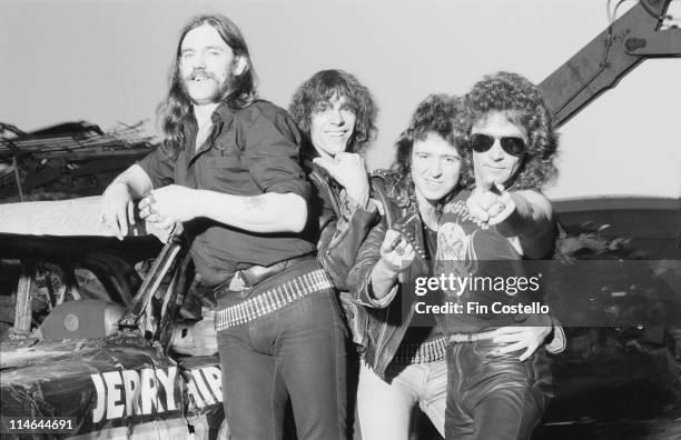 British rock group Motorhead posed at Chelsea Metals scrapyard in Pimlico, London on 8th June 1984. Left to Right: Lemmy, Mick 'Wurzel' Burston, Phil...