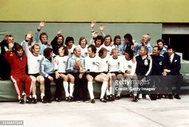 The West Germany squad celebrate after their 2-1 victory over Holland in the 1974 FIFA World Cup Final at the Olympic Stadium on July 7, 1974 in...