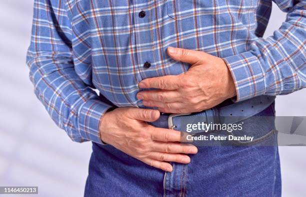 stomach ache - appendicitis stock-fotos und bilder