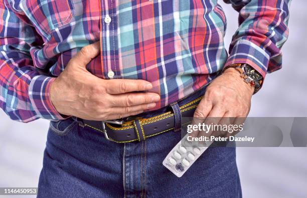 senior man in pain - hernia stock pictures, royalty-free photos & images