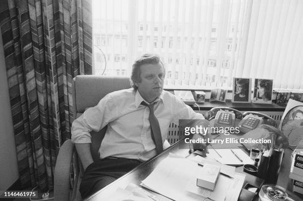 English television executive and businessman Michael Grade, currently Controller of the television channel BBC1, pictured at his desk circa 1985.