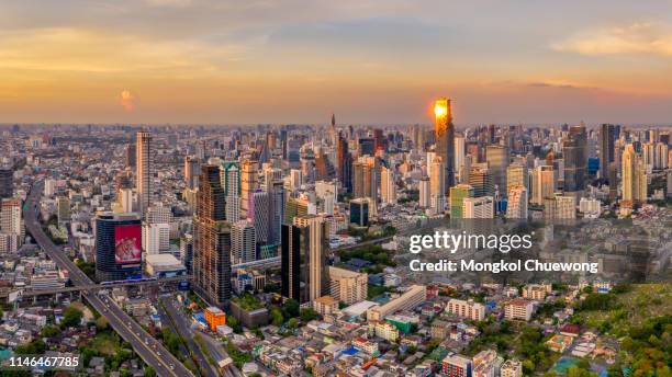 panorama aerial view of bangkok skyline and skyscraper with bts skytrain bangkok downtown in thailand at sunset. - bts bangkok stock pictures, royalty-free photos & images