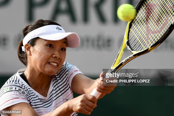 Japan's Kurumi Nara plays a backhand return to Slovenia's Dalila Jakupovic during their women's singles first round match on day two of The Roland...