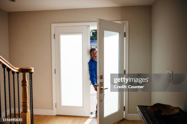 mature man at front door of his house - returning home after work stock pictures, royalty-free photos & images