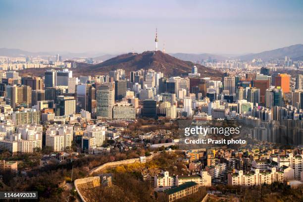 view of downtown cityscape and seoul tower in seoul, south korea. - namsan seoul stock pictures, royalty-free photos & images