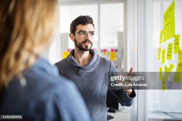 business people discussing on adhesive notes - sales executive stock pictures, royalty-free photos & images