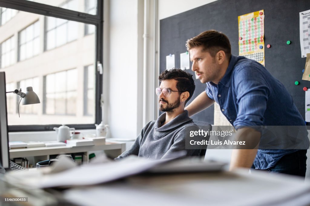 Using Computer With Partner Partners Working On Computer Together High-Res Stock Photo - Getty Images