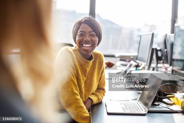 colleagues having casual talk during work - differential focus stock pictures, royalty-free photos & images