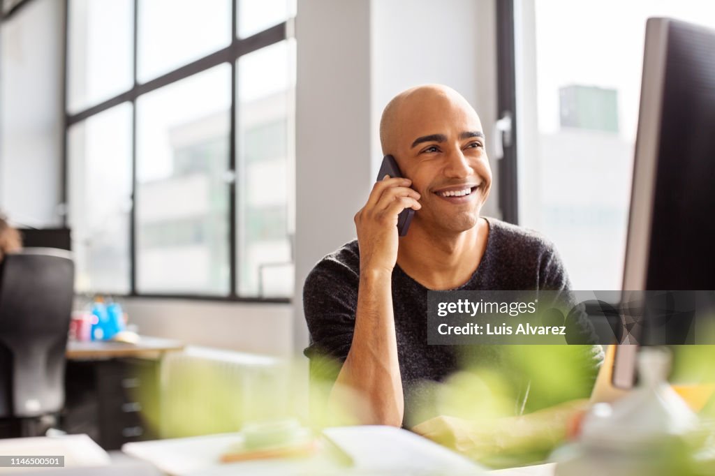 Male professional working at his office desk