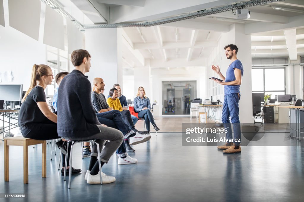 Man discussing new ideas with team