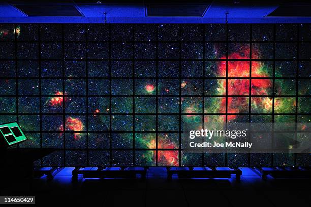 At NASA's Advanced Supercomputing facility, a colorized red and green nebulae span a vast region of our galaxy over 128 monitors. This system, known...