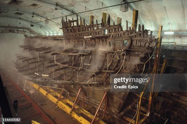 The wooden wreck of the Mary Rose warship is kept wet whilst undergoing conservation in the ship hall, Portsmouth July 1987. The Mary Rose was...