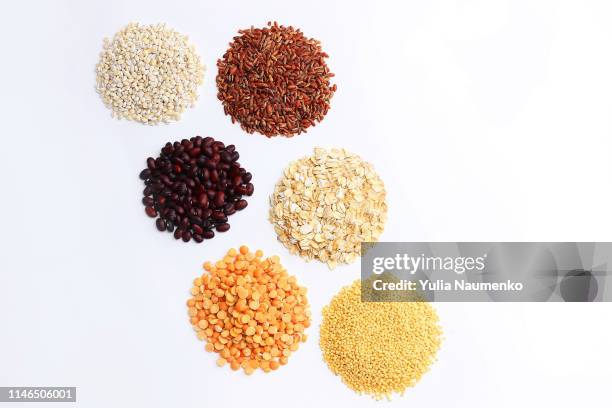 set of six groats laid out on a white background, the concept of proper and healthy eating - rice grain foto e immagini stock