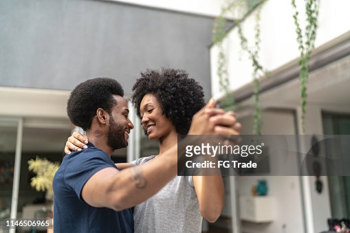 Lovely African Couple Dancing At Home High-Res Stock Photo - Getty Images