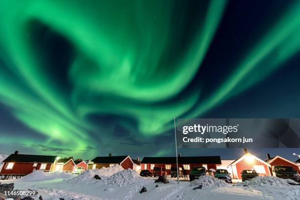 aurora over sky hamnoy, norway, scandinavia - aurora borealis lofoten stock-fotos und bilder