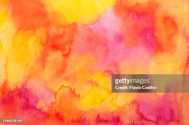 watercolor background in yellow, red, orange and pink tones - water color brush stroke stock-fotos und bilder