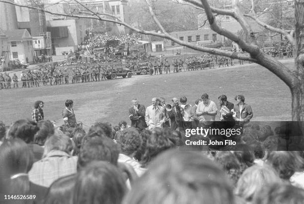 On Blanket Hill, Kent State University faculty use megaphones to try and convince antiwar demonstrators and students to disperse after the Ohio...