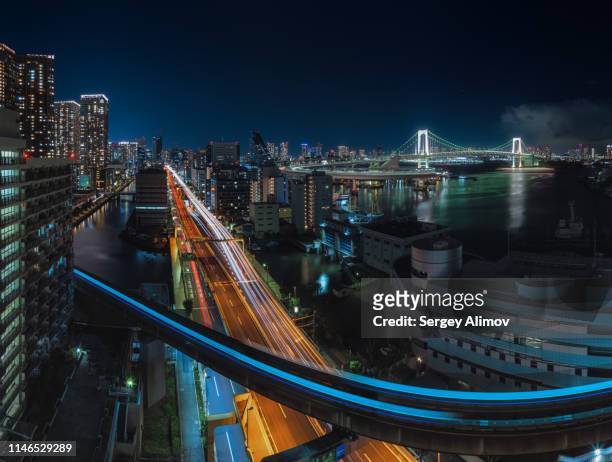 minato ward of tokyo night cityscape and rainbow bridge view - travel panoramic stock pictures, royalty-free photos & images