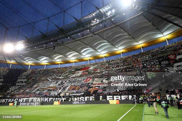 Eintracht Frankfurt fans welcome their team prior to with a 'tifo' display prior to the UEFA Europa League Semi Final First Leg match between...