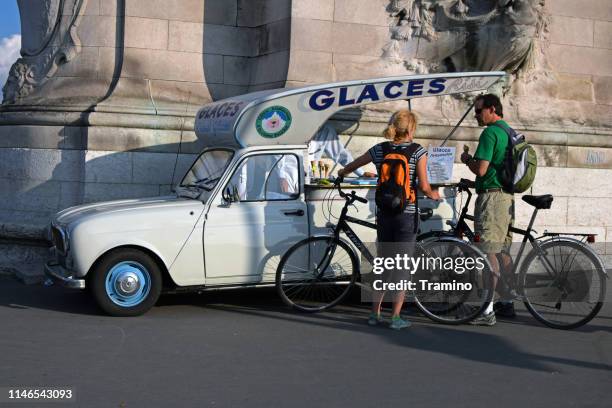 classic ice-cream car on the street - old renault stock pictures, royalty-free photos & images