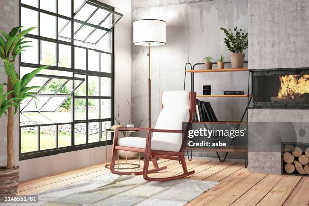 loft room with fireplace and armchair - rocking chair stock pictures, royalty-free photos & images