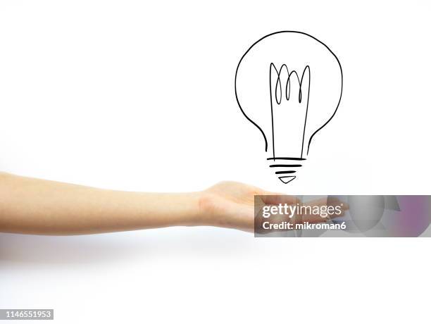 hand holding out palm straight with a lightbulb - cartoon arms stock-fotos und bilder