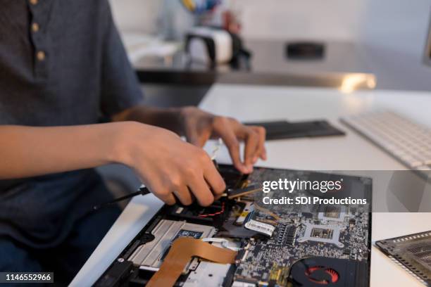 unrecognizable person assembles computer - computer taken apart stock pictures, royalty-free photos & images