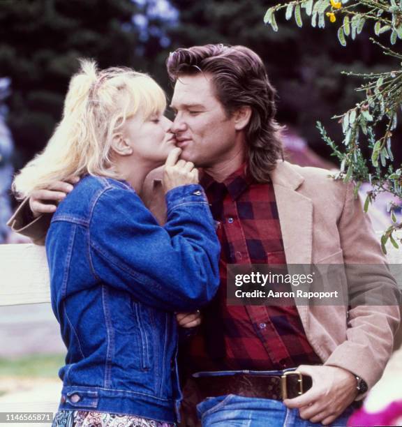 While shooting the movie "Overboard", actors Goldie Hawn and Kurt Russell pose for a portrait in October 1987 in Fort Bragg, California.