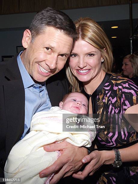 Dayna Devon with her husband, Dr. Brent Moelleken and their baby daughter, Emmi