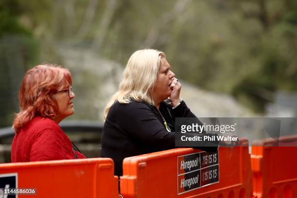 Anna Osborne and Sonya Rockhouse from the Family Reference Group pause for reflection at the entrance to the Pike River Coal mine on May 03, 2019 in...