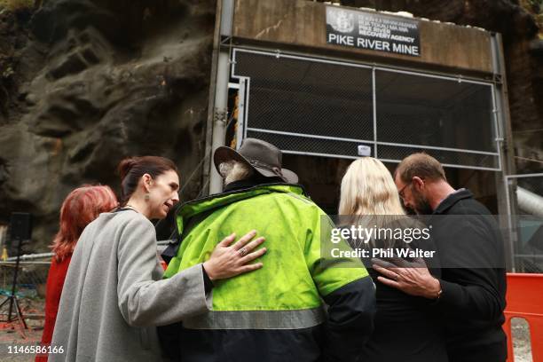 Prime Minister Jacinda Ardern and Andrew Little, the Minister Responsible for Pike River Re-entry console family members at the entrance to the Pike...