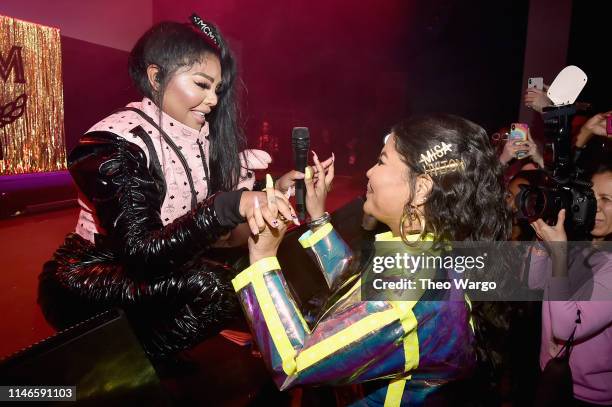 Lil' Kim performs for Misa Hylton Brim during the premiere of "The Remix: Hip Hop x Fashion" at Tribeca Film Festival at Spring Studios on May 02,...