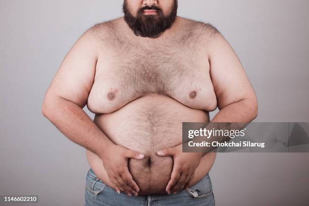 fat man with body hair. - male abdomen stock pictures, royalty-free photos & images