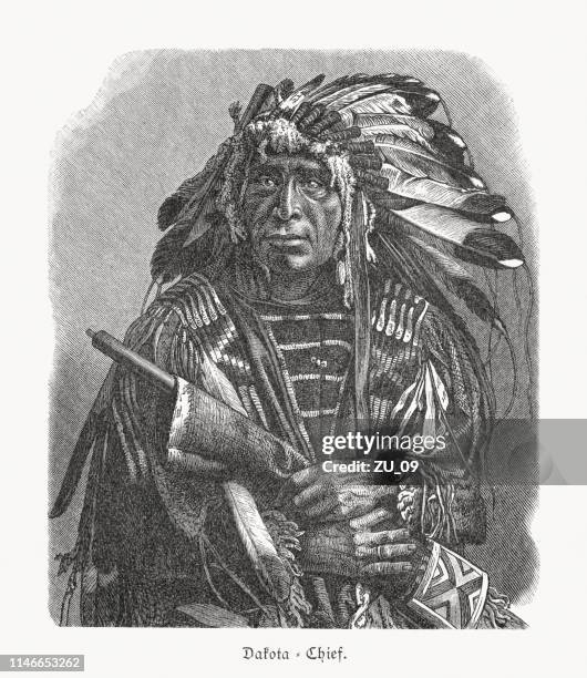 dakota chief, wood engraving, published in 1897 - sioux native americans stock illustrations