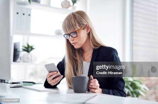 this doesn't look good at all - unhappy woman blonde glasses stock pictures, royalty-free photos & images