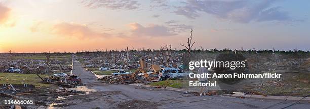 Person surveys damage one day after a tornado tore through Joplin killing at least 122 people on May 23, 2011 in Joplin, Missouri. The tornado that...