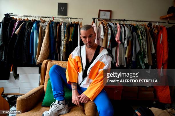 Mexican fashion designer Andres Jimenez, who creates genderless garments under the label Mancandy, poses at his studio in Mexico City on May 14,...