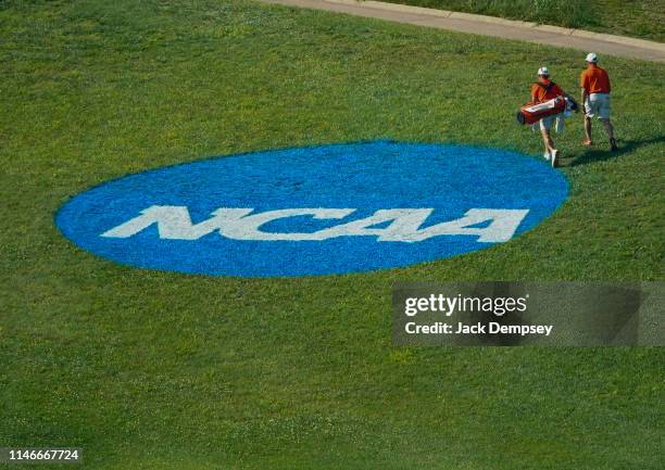 Clemson golfer walks by the NCAA Photos via Getty Images logo painted on the grass during the Division I Men's Golf Stroke Play Championship held at...