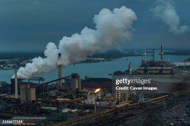 coke release, steel mill, zug island, rouge and detroit river - air quality stock pictures, royalty-free photos & images