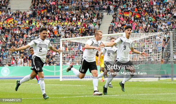 Emrehan Gedikli of Germany celebrates with teammates after scoring his team's first goal during the international friendly match between U16 Germany...