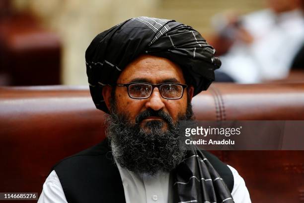 Representatives of Taliban led by Mullah Abdul Ghani Baradar attend a meeting on Afghan talks with Afghan politicians within a conference marking a...