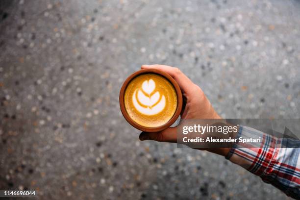 drinking coffee from a cup, personal perspective directly above view - mittig stock-fotos und bilder