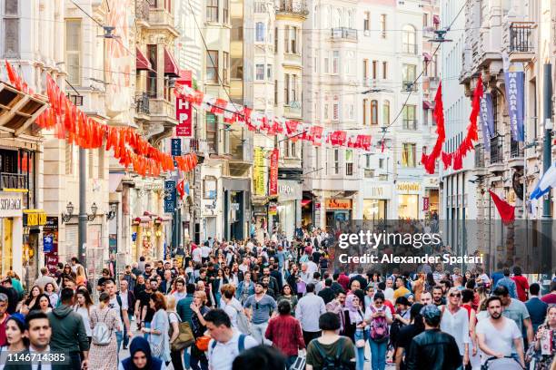 crowds of people at pedestrian shopping street istiklal caddesi in istanbul, turkey - istanbul street stock pictures, royalty-free photos & images