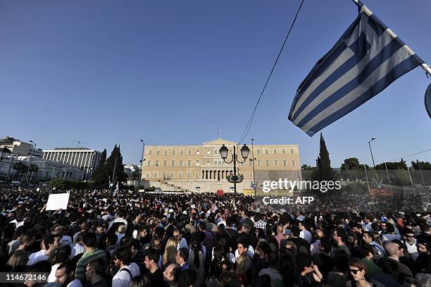 Protesters demonstrate in front of the Greek parliament against a new austerity package in Athens on May 25, 2011. More than 10,000 people, according...