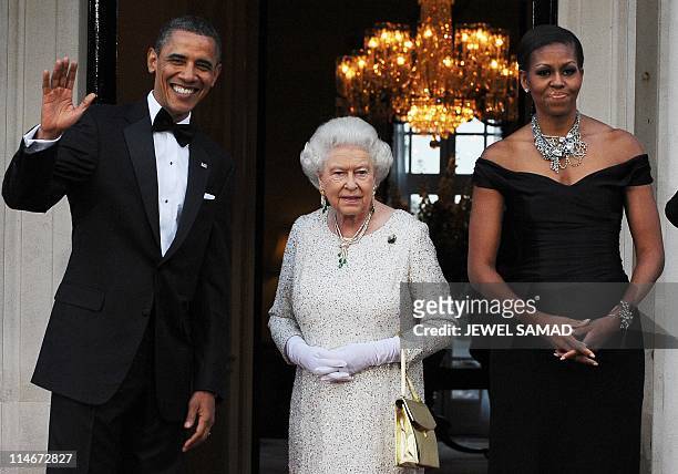 President Barack Obama and First Lady Michelle Obama greet Britain's Queen Elizabeth II before a reciprocal dinner at the Winfield House in London,...