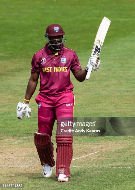 Andre Russell of West Indies acknowledges the applause on reaching his half-century during the ICC Cricket World Cup 2019 Warm Up match between West...