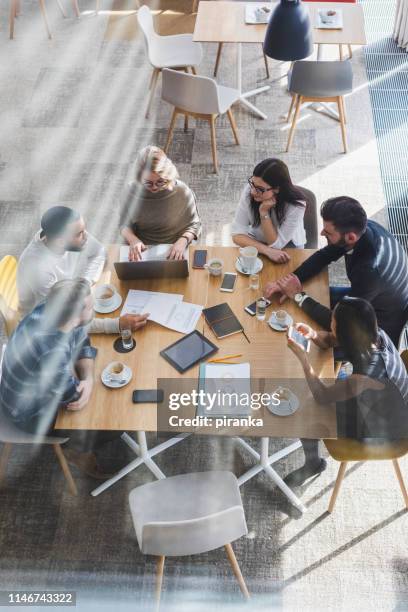 creative team - business meeting cafe stock pictures, royalty-free photos & images