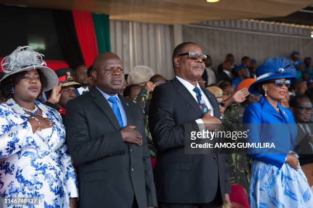 Malawi's President elect Arthur Peter Mutharika , his wife Gertrude , the Vice president elect Everton chimulirenji and his wife Ruth sing the...
